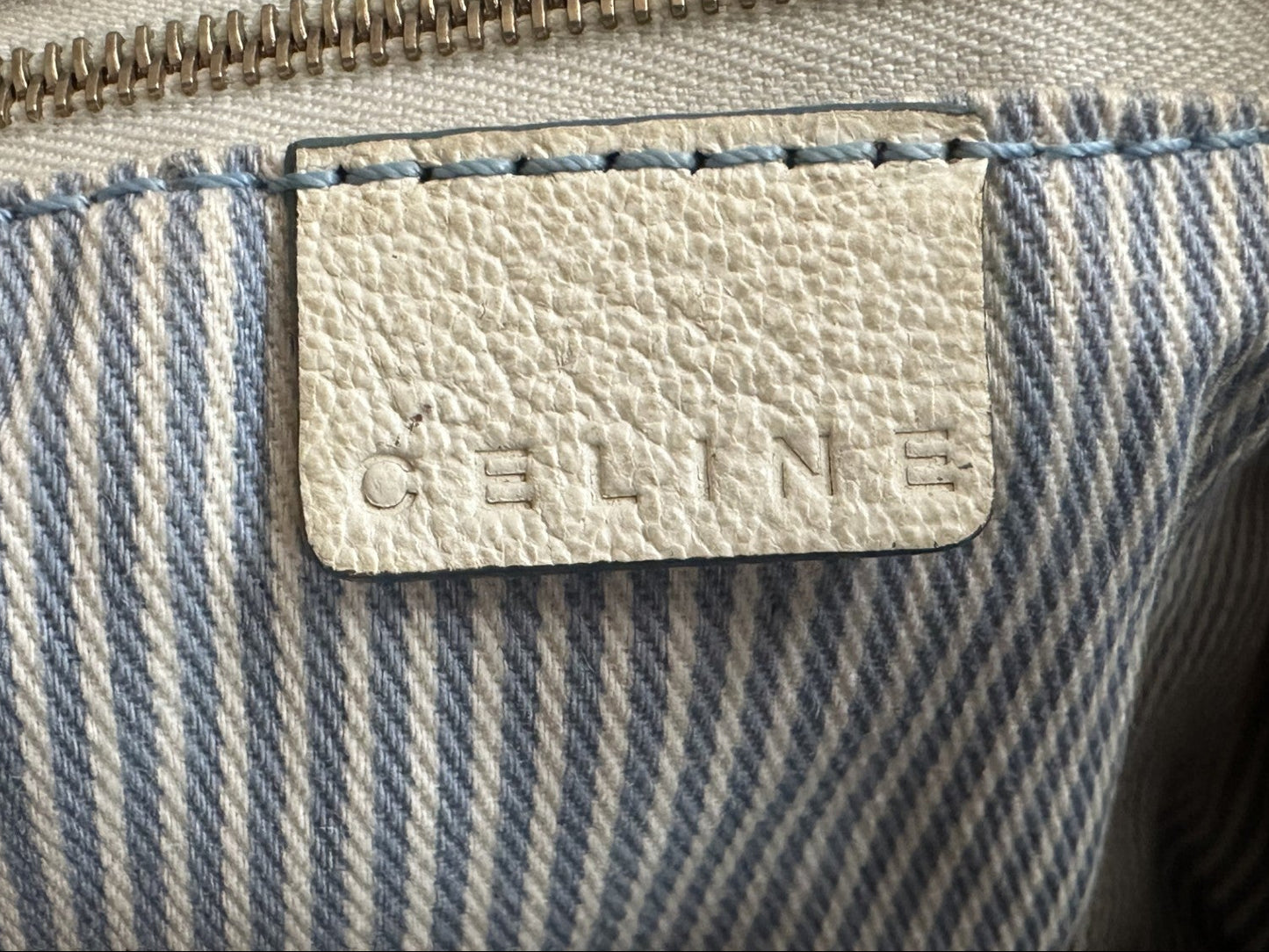 Close-up of a Celine bag with a visible brand logo.