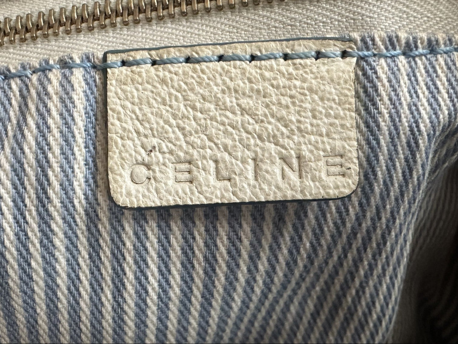 Close-up of a Celine bag with a visible brand logo.